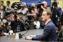  ?? CHIP SOMODEVILL­A / GETTY IMAGES ?? Facebook CEO Mark Zuckerberg prepares to testify Wednesday before a House committee. He said his company “can do a better job of explaining how advertisin­g works.”