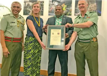  ??  ?? At the presentati­on at the Tanoa Plaza Hotel in Suva. (From left) NZ Defence Force Advisor Lieutenant Colonel Josh Wineera, NZ Ministry of Defence Senior Analyst, Kate Boocock, Minister Inia Seruiratu and