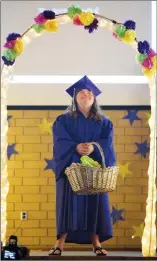  ?? NEWS PHOTO EMMA BENNETT ?? Grade 12 graduate Madison Hill smiles while her classmates sing “Sunshine a n d Lollipops” during her graduation ceremony at Herald School on Thursday morning.