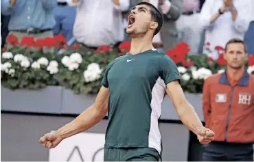  ?? | EMILIO NARANJO ?? TENNIS star Carlos Alcaraz, 19, won the Mutua Madrid Open after defeating defending champion Alexander Zverev in the final match at Caja Magica sport complex in Madrid, Spain, yesterday. The young Spaniard stunned Novak Djokovic and Raphael Nadal to reach the finals.