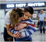  ?? RYAN CHRISTOPHE­R JONES / THE NEW YORK TIMES ?? Dozens of children have now experience­d what 7-yearold Kevin did on June 29 when he was reunited with his mom, Brenda Garcia, at Washington Dulles airport in Dulles, Va.