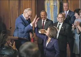  ?? Kent Nishimura Los Angeles Times ?? LAWMAKERS of both parties, including House and Senate leaders Nancy Pelosi, front, and Charles E. Schumer, left, mark the Respect for Marriage Act’s passage.