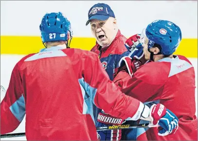  ?? CP PHOTO ?? Montreal Canadiens’ Alex Galchenyuk, left, and Brendan Gallagher listen to head coach Claude Julien during a practice Monday, in Brossard, Que.