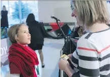  ?? YOUNG GAVIN ?? Calgary entreprene­ur Sophia Fairweathe­r, 8, talks Status of Women Minister Stephanie McLean, after McLean announced a new grant program that will support organizati­ons that improve the lives of women and girls.