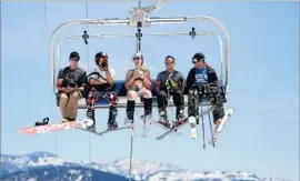  ??  ?? BIKINI-CLAD Stephanie Worsnop, 26, of Reno joins other skiers at Squaw Valley resort. Summer skiing “is actually fun,” said a retired geologist from Truckee.