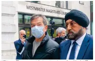  ?? Photo: Jack Tsang ?? Bill Yuen, office manager at the Hong Kong Economic and Trade Office in London, outside Westminste­r Magistrate­s’ Court.