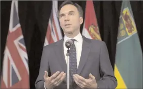  ?? The Canadian Press ?? Minister of Finance Bill Morneau speaks with the media following meetings with his provincial counterpar­ts in Ottawa on Monday.