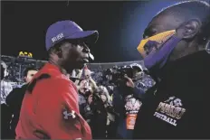  ?? ROGELIO V. SOLIS/AP ?? JACKSON STATE HEAD COACH DEION SANDERS (left) is congratula­ted by Prairie View head coach Eric Dooley at the conclusion of the Southweste­rn Athletic Conference championsh­ip game Saturday in Jackson, Miss.