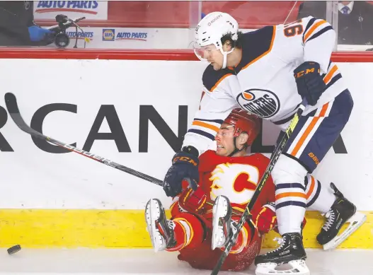  ?? LARRY MACDOUGAL/THE CANADIAN PRESS ?? The last time the Edmonton Oilers played was April 10, when Gaetan Haas ran over Calgary Flames forward Derek Ryan on the way to a 5-0 loss.