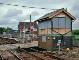  ?? MNR ?? Still resplenden­t in LNER green and cream livery, the boarded-up GER signalbox at Spooner Row awaits dismantlin­g for its move to the Mid-Norfolk Railway.