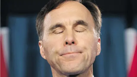  ?? ADRIAN WYLD / THE CANADIAN PRESS ?? Minister of Finance Bill Morneau bent to public pressure Thursday, saying he would set up a blind trust after saying he was told it wasn’t required.