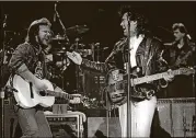  ?? GRAND OLE OPRY ARCHIVES/ BILL THORUP ?? Travis Tritt and Marty Stuart perform at the Grand Ole Opry in 1991.