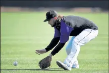  ?? Andy Cross / The Denver Post ?? The Rockies’ Brendan Rodgers takes a grounder on Tuesday at Salt River Fields at Talking Stick in Scottsdale, Ariz.