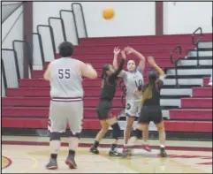  ?? JOHN SANDERS/Valley Press Sports Correspond­ent ?? AVC’s Jordan Johnson (10) gets double-teamed as she sends the ball to teammate Courtney Hart (55) during Friday’s season opener against Pasadena City College at Marauder Gym. The Marauders won 64-51.