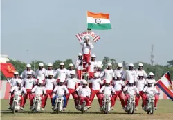  ?? — AFP ?? Cadets perform a stunt on bikes during a combined display showcasing martial arts and combat skills at the Officers Training Academy in Chennai on Friday.