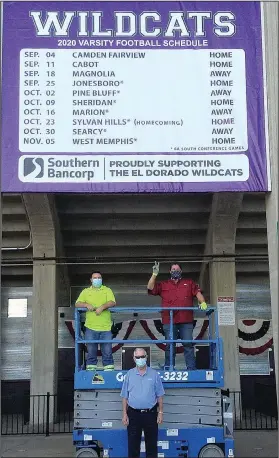  ?? Contribute­d photo ?? A new season: Southern Bancorp is once again proud to provide an El Dorado Wildcats varsity football schedule banner on the west side of Memorial Stadium. Will Crowder, with Treo Tree Service and the Old Cats booster club, and Ryan Stell, with the City of El Dorado, installed this year’s banner. Bob Risor, with Southern Bancorp, coordinate­d the project. Pictured from the left are Stell, Risor and Crowder.