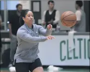  ?? CHARLES KRUPA — THE ASSOCIATED PRESS ?? Celtics assistant Kara Lawson passes the ball in 2019at the team’s training facility in Boston.