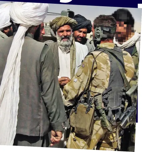  ??  ?? Let’s shake on it: Major Jowett talks to Afghan elders flanked by his interprete­r whose face is obscured