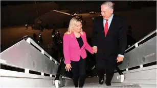  ?? (Amos Ben-Gershom/GPO) ?? PRIME MINISTER Benjamin Netanyahu and his wife, Sara, board a plane at Ben-Gurion Airport last month.