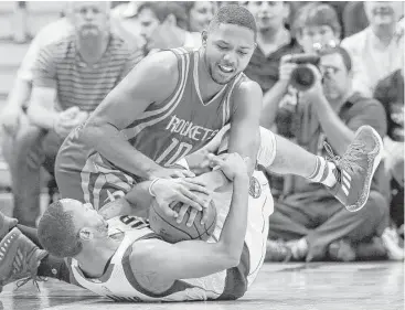  ?? LM Otero / Associated Press ?? Rockets guard Eric Gordon, top, has grabbed a starting role for what he intends to be a career year.