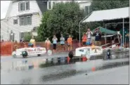  ?? DFM FILE PHOTO ?? Payton Kilak races Ella Pergine in the Soapbox Derby on the 4th of July. Friday, July 4, 2014.