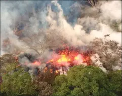  ?? AP PHOTO/CALEB JONES U.S. GEOLOGICAL SURVEY VIA AP ?? Marie Brant, of Laguna Niguel, Calif., watches as ash rises from the summit crater of Kilauea volcano Thursday in Volcano, Hawaii. Brant is on vacation in Hawaii. The volcano on Hawaii's Big Island erupted anew Thursday shortly after 4 a.m. with little...