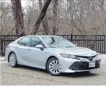  ?? BRIAN HARPER ?? The 2018 Toyota Camry Hybrid’s strengths could help the struggling four-door family sedan segment get a bit more mileage.