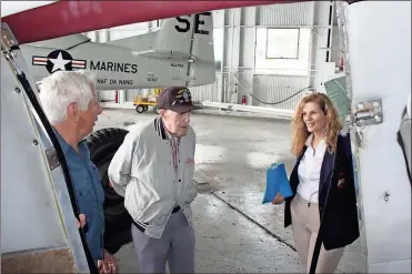  ?? Diane Wagner / RN-T ?? Museum of Flight maintenanc­e coordinato­r Tony Sommer (from left), volunteer Johnny Shook and developmen­t director Holly Kelly talk Tuesday about plans for a June 2 open house at Richard B. Russell Regional Airport.