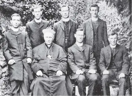  ?? PHOTO: OTAGO WITNESS ?? Religious leader . . . Roman Catholic Bishop of Dunedin Michael Verdon in 1909, with graduates of Holy Cross College in Mosgiel, a school that he founded.