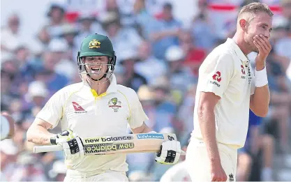  ??  ?? Australia captain Steve Smith smiles as he runs between the wickets while England’s Stuart Broad covers his mouth.