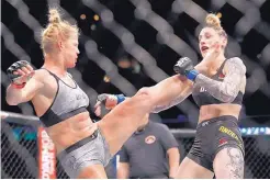  ?? JIM YOUNG/ASSOCIATED PRESS ?? Holly Holm’s victory over Megan Anderson, right, sets her up for a possible UFC title shot against Amanda Nunes.