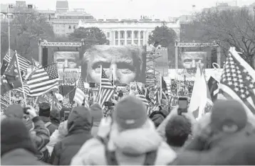  ?? JOHN MINCHILLO/AP 2021 ?? Supporters of then-President Trump were told to “fight like hell” last Jan. 6 near the White House.