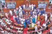  ??  ?? Members gather near the well of the House, in the Rajya Sabha during the monsoon session on August 11.