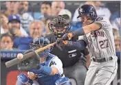  ??  ?? Houston Astros’ Jose Altuve hits a home run against the Los Angeles Dodgers during the World Series.