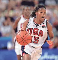  ?? GETTY IMAGES ?? Nikki Mccray dribbles the ball against Russia during the Women's Basketball competitio­n, part of the 2000 Sydney Summer Olympics.