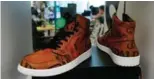  ??  ?? A pair of Air Jordan 1 Retro High shoes that have been authentica­ted are on display at the offices of Stock X.