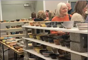  ?? ERICA BOUSKA — MEDIANEWS GROUP ?? Shelves and tables full of the handmade bowls available at the Chili Bowl.