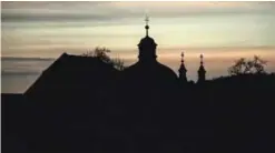  ??  ?? The silhouette of the Pilgrim Church (Wallfahrtk­irche) is seen in the village of Christkind­l.