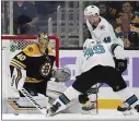  ?? WINSLOW TOWNSON — THE ASSOCIATED PRESS ?? The Sharks’ Logan Couture, right, has a shot stopped by Bruins goaltender Tuukka Rask on the recent trip.