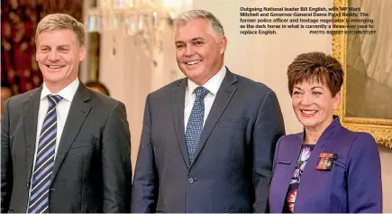  ?? PHOTO: ROBERT KITCHIN/STUFF ?? Outgoing National leader Bill English, with MP Mark Mitchell and Governor-General Dame Patsy Reddy. The former police officer and hostage negotiator is emerging as the dark horse in what is currently a three-way race to replace English.