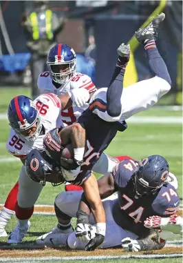  ?? GETTY IMAGES ?? Bears running back David Montgomery landed on his head after being flipped into the air in the second quarter Sunday, but he was able to return.