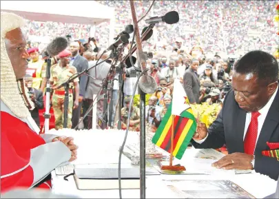  ??  ?? President Emmerson Mnangagwa, seen here signing his Oath of Office before Chief Justice Luke Malaba during his swearing in as Head of State on Friday last week, has been endorsed by ZANU-PF Mashonalan­d West provincial leadership as the party’s...