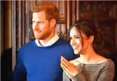  ?? — Reuters photo ?? Harry and Markle watch a performanc­e by a Welsh choir in the banqueting hall during a visit to Cardiff Castle in Cardiff, Britain in this file photo.
