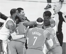  ?? Marcio Jose Sanchez / Associated Press ?? The October fracas between the Rockets' Chris Paul, second from left, and the Lakers' Rajon Rondo, top right, has long since been forgotten by Paul.