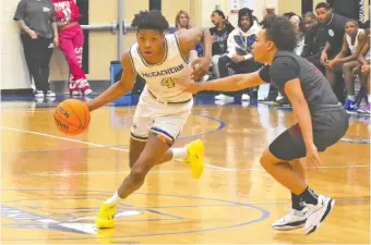  ?? STAFF PHOTO BY PATRICK MACCOON ?? McEachern High School senior Ace Bailey dribbles past midcourt in the GHSA Region 7-AAAAAAA title game against visiting Hillgrove on Feb. 16 in Powder Springs, Ga. Bailey spent his freshman season at Boyd Buchanan.