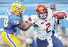  ?? Keith Srakocic / Associated Press ?? Syracuse quarterbac­k Eric Dungey, right, ran for a team-high 70 yards, but he was erratic passing, with two intercepti­ons.