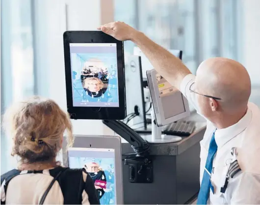  ?? RAY WHITEHOUSE/THE NEW YORK TIMES 2018 ?? A traveler undergoes a facial recognitio­n screening at Dulles Internatio­nal Airport in Dulles, Virginia.
