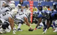  ?? SETH WENIG — THE ASSOCIATED PRESS ?? The Los Angeles Chargers offense lines up against the New York Giants defense during the second half of an NFL football game, Sunday in East Rutherford, N.J.