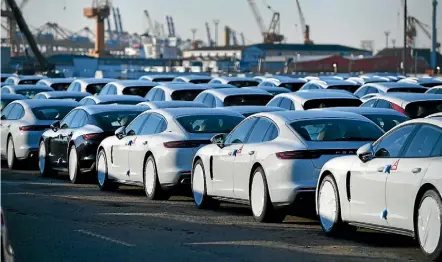  ?? GETTY IMAGES ?? Porsche cars stand at a German dock ready for export. Germany and the European Union are trying to prevent US tariffs that threaten Europe’s economic recovery.