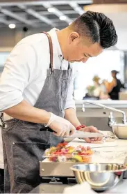  ??  ?? Chef Masaru Fukuda prepares Peruano ceviche at Pacha Nikkei.